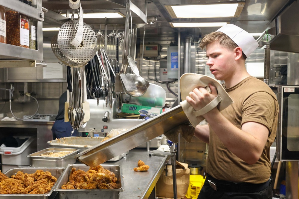 John Finn prepares a meal