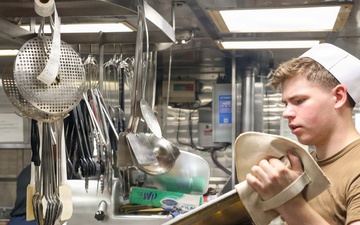 John Finn prepares a meal