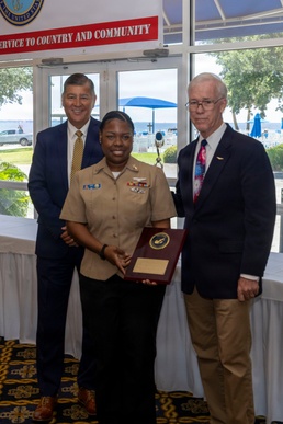 Air Traffic Controller 1st Class Shakila Duff receives the 2026 Margaret Flowers Outstanding Military Volunteer Award