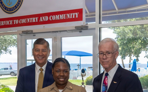 Air Traffic Controller 1st Class Shakila Duff receives the 2026 Margaret Flowers Outstanding Military Volunteer Award