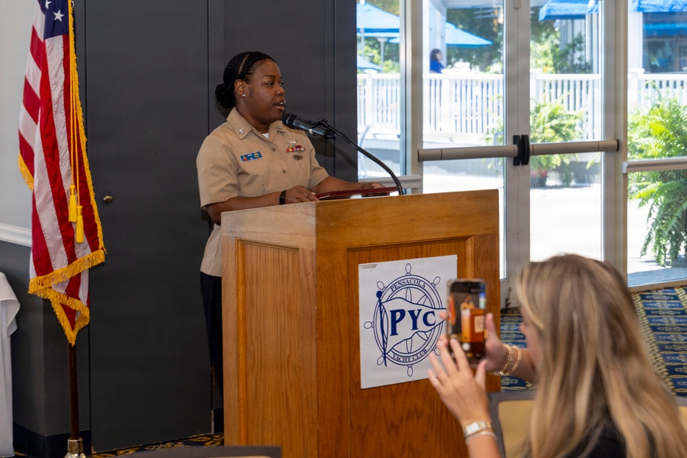 Air Traffic Controller 1st Class Shakila Duff receives the 2026 Margaret Flowers Outstanding Military Volunteer Award