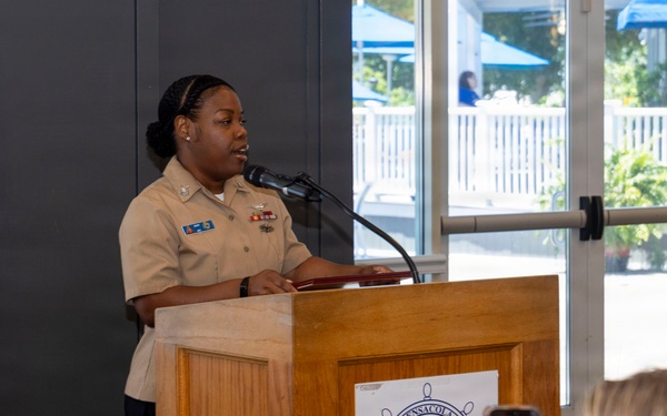 Air Traffic Controller 1st Class Shakila Duff receives the 2026 Margaret Flowers Outstanding Military Volunteer Award