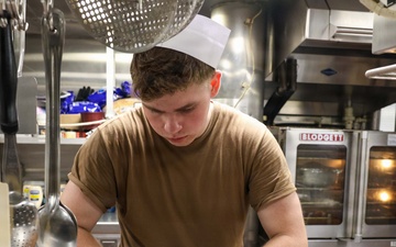 John Finn prepares a meal