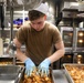 John Finn prepares a meal