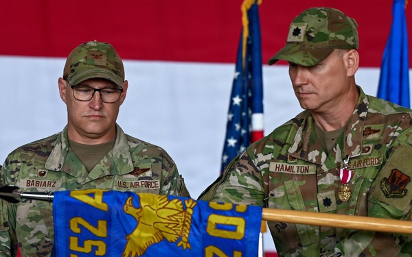 U.S. Air Force Officers Case Unit Guidon During Change of Command Ceremony