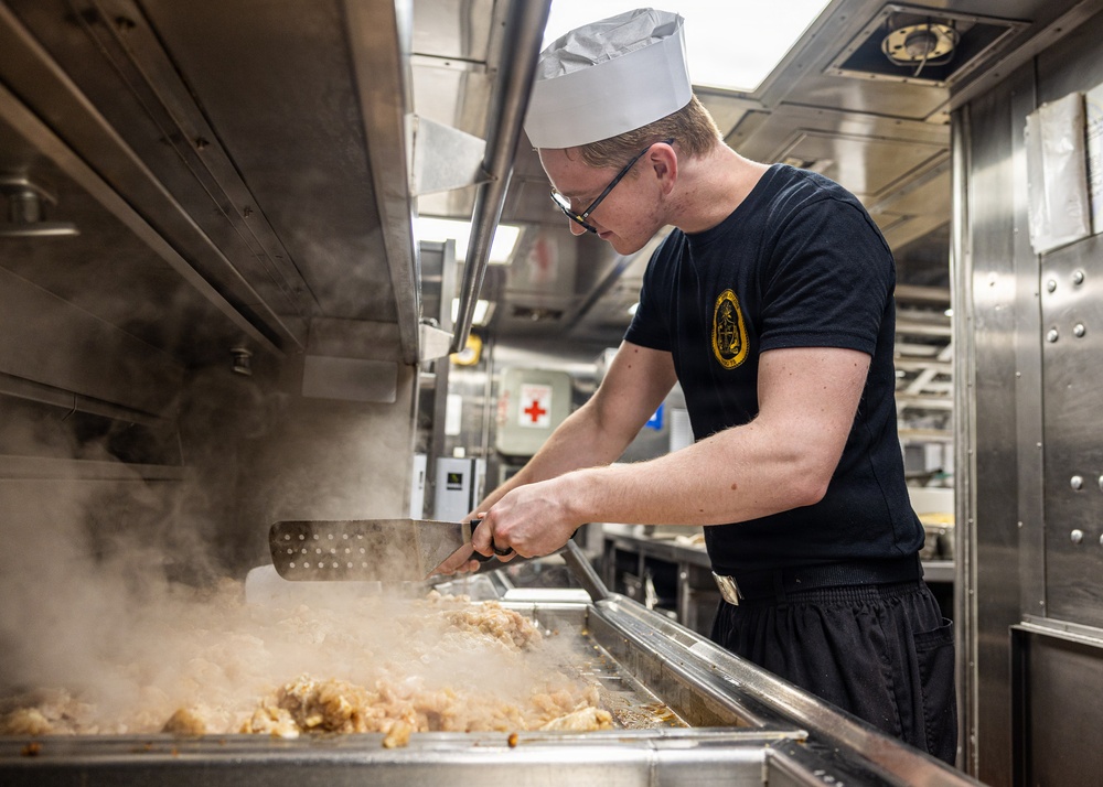 USS Donald Cook (DDG 75) prepares chicken for the crew