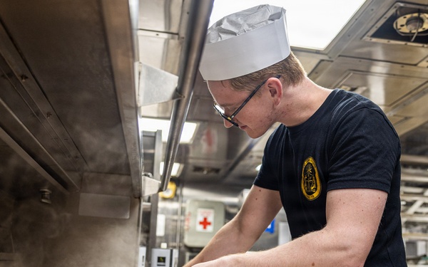 USS Donald Cook (DDG 75) prepares chicken for the crew