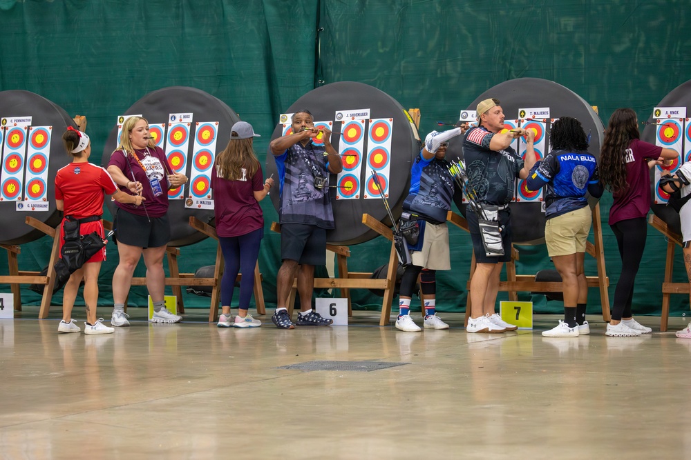 Competitors Recover Arrows Archery Event.