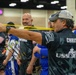 SOCOM competitor stretches before archery event