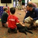 Smoky the therapy dog meets families at 2026 Warrior Games