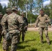 U.S. Marines and Latvian soldiers conduct a decontamination zone in the Baltic region