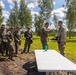 U.S. Marines and Latvian soldiers conduct a decontamination zone in the Baltic region