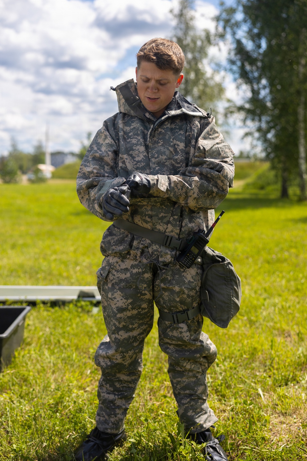 U.S. Marines and Latvian soldiers conduct a decontamination zone in the Baltic region
