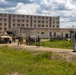 U.S. Marines and Latvian soldiers conduct a decontamination zone in the Baltic region