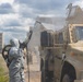 U.S. Marines and Latvian soldiers conduct a decontamination zone in the Baltic region