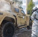 U.S. Marines and Latvian soldiers conduct a decontamination zone in the Baltic region