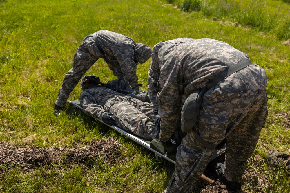 U.S. Marines and Latvian soldiers conduct a decontamination zone in the Baltic region