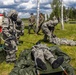 U.S. Marines and Latvian soldiers conduct a decontamination zone in the Baltic region