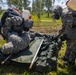 U.S. Marines and Latvian soldiers conduct a decontamination zone in the Baltic region