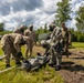 U.S. Marines and Latvian soldiers conduct a decontamination zone in the Baltic region