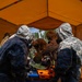U.S. Marines and Latvian soldiers conduct a decontamination zone in the Baltic region