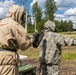 U.S. Marines and Latvian soldiers conduct a decontamination zone in the Baltic region