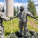 U.S. Marines and Latvian soldiers conduct a decontamination zone in the Baltic region