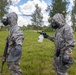 U.S. Marines and Latvian soldiers conduct a decontamination zone in the Baltic region