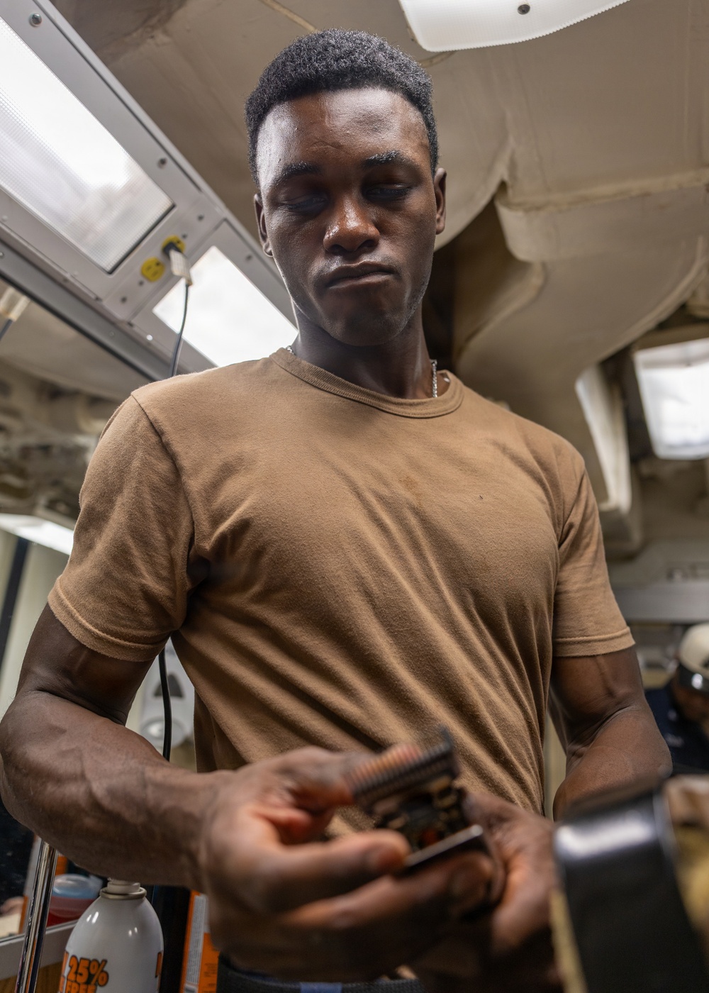 USS Ross Sailor changes the guard on his clippers