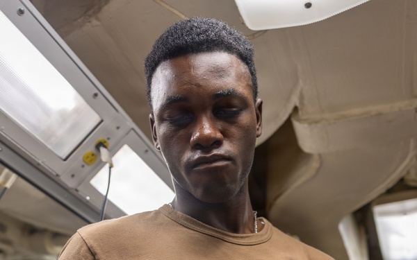 USS Ross Sailor changes the guard on his clippers