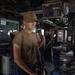 USS Ross Sailor serves as a helmsman