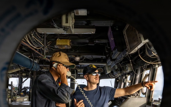 USS Ross Sailors stand watch