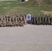 Iowa National Guard and Kosovo Security Force communication airmen and soldiers pose for group photo