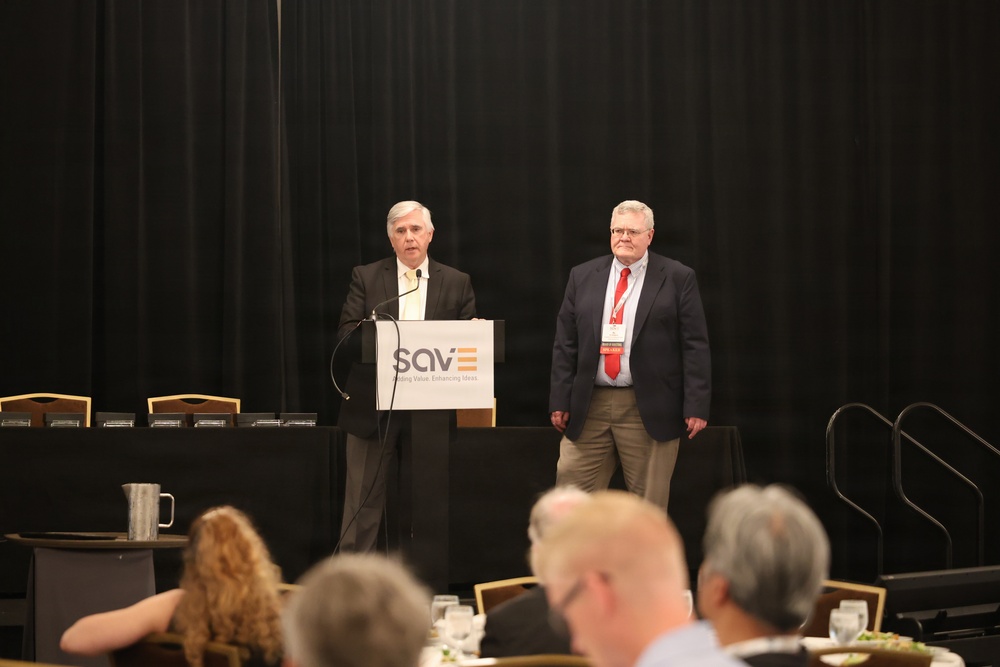 Speaker addresses attendees at SAVE organization conference luncheon