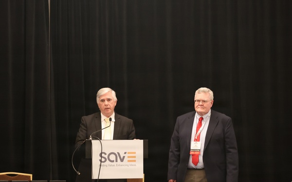 Speaker addresses attendees at SAVE organization conference luncheon