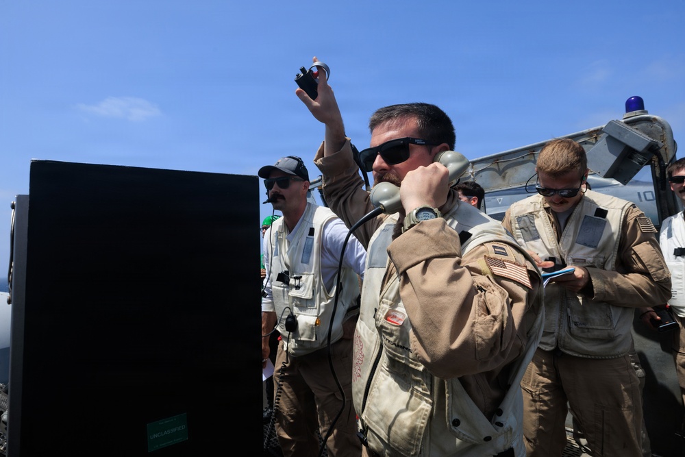 USS George H.W. Bush signal aircraft for landing