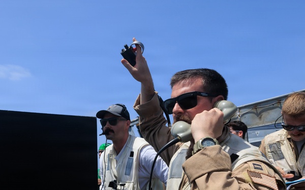 USS George H.W. Bush signal aircraft for landing