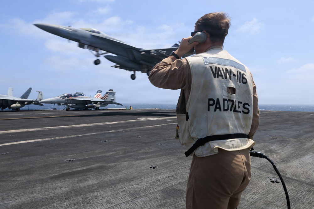 USS George H.W. Bush signal aircraft for landing