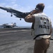USS George H.W. Bush signal aircraft for landing