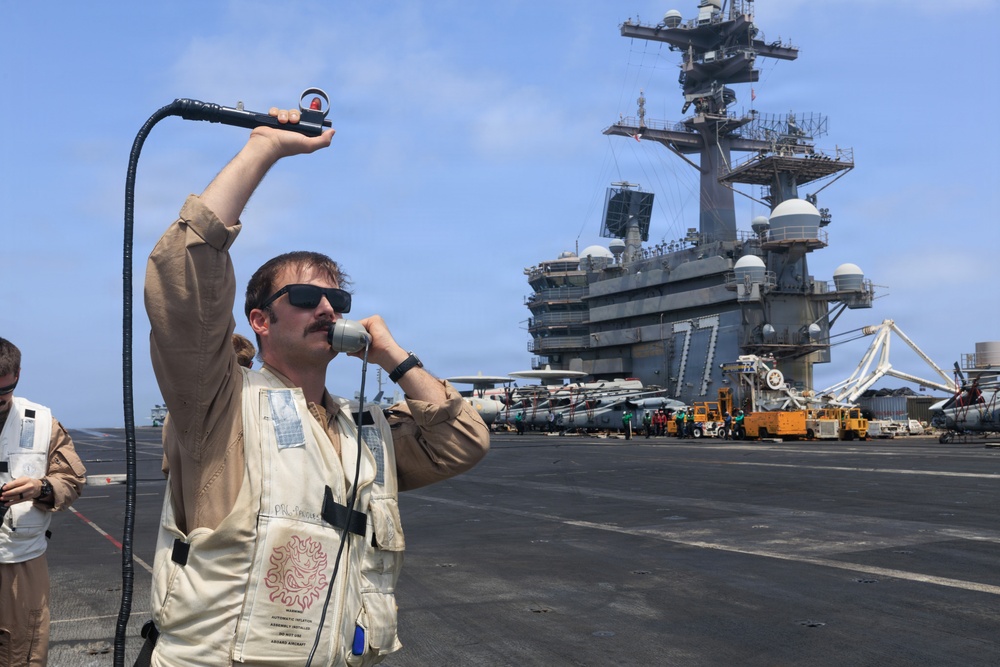USS George H.W. Bush signal aircraft for landing