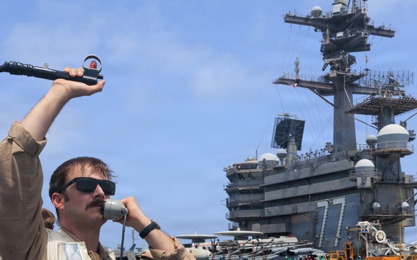 USS George H.W. Bush signal aircraft for landing