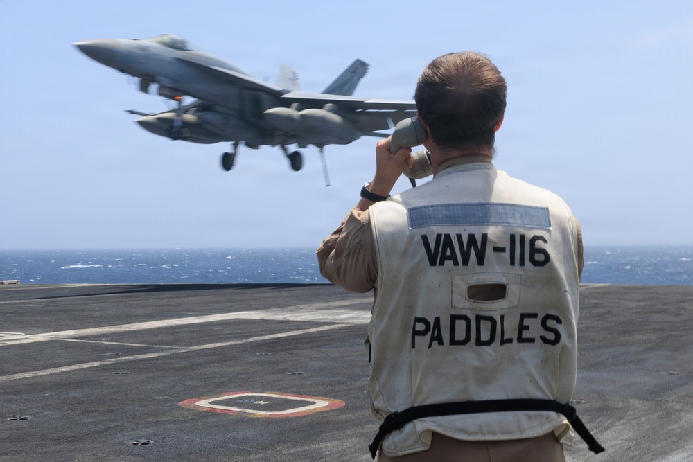 USS George H.W. Bush signal aircraft for landing