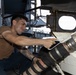 USS George H.W. Bush Sailor attaches a fueling hose