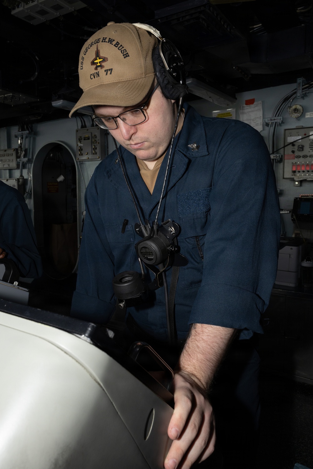 USS George H.W. Bush Sailor stands watch