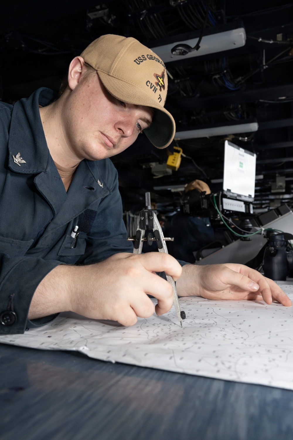 USS George H.W. Bush Sailor references a chart