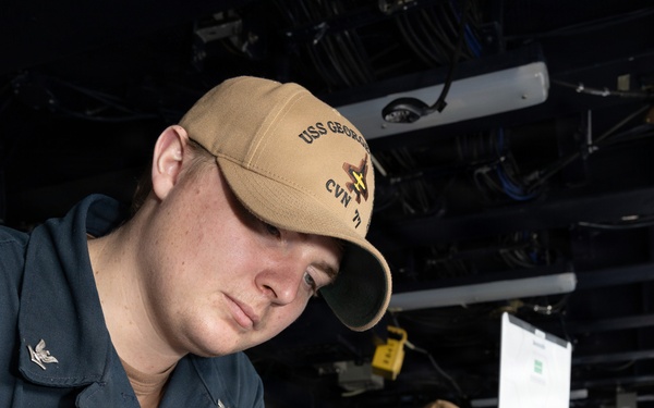 USS George H.W. Bush Sailor references a chart
