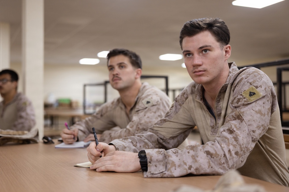 U.S. Marines and Sailors Attend a Marine Corps Artillery History Class