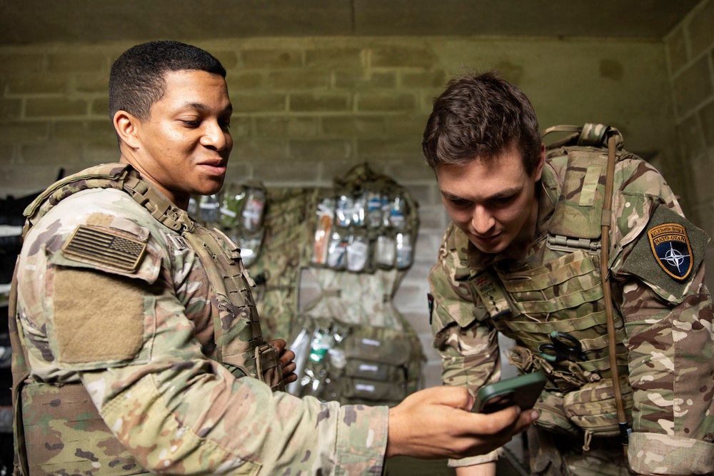 U.S. and British Army medics train together during close-quarters battle drills