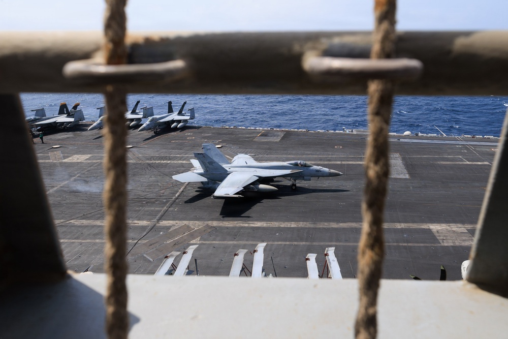 USS George H.W. Bush prepares to land aircraft