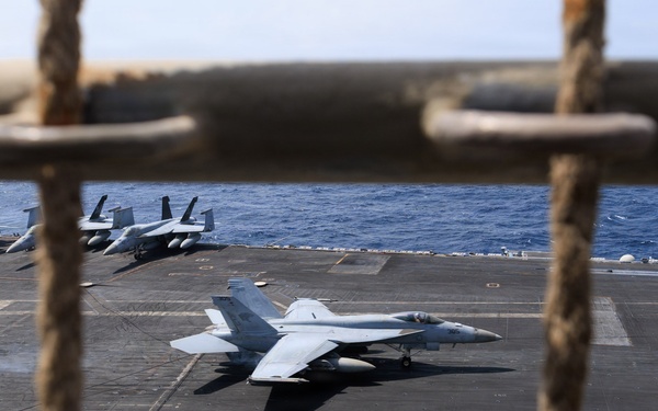 USS George H.W. Bush prepares to land aircraft
